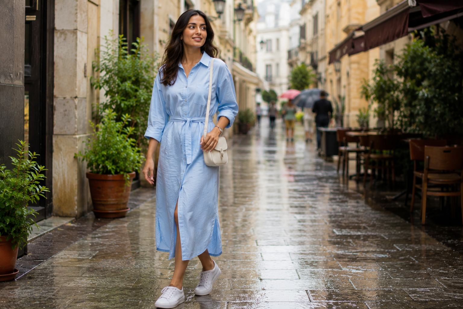 Indian woman in a sky blue linen shirt dress during monsoon.